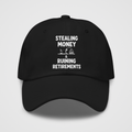 SMRR Hat – front view: black dad hat with white-ink "Stealing Money & Ruining Retirements" text and a small beach-house scene, Santa Monica politics satire by TrollGov